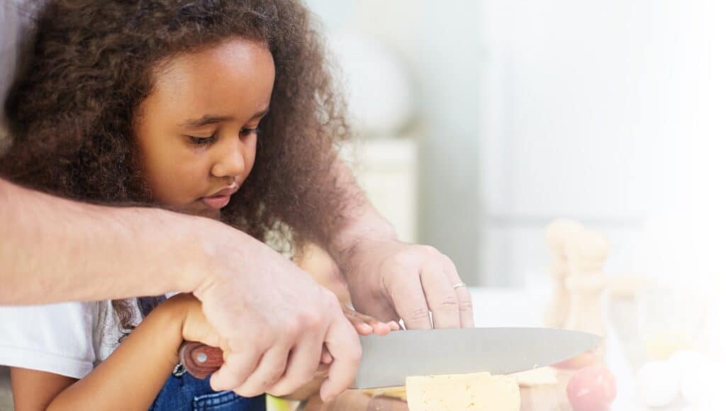 child learning knife skills