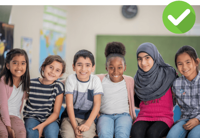 kids smiling in a classroom