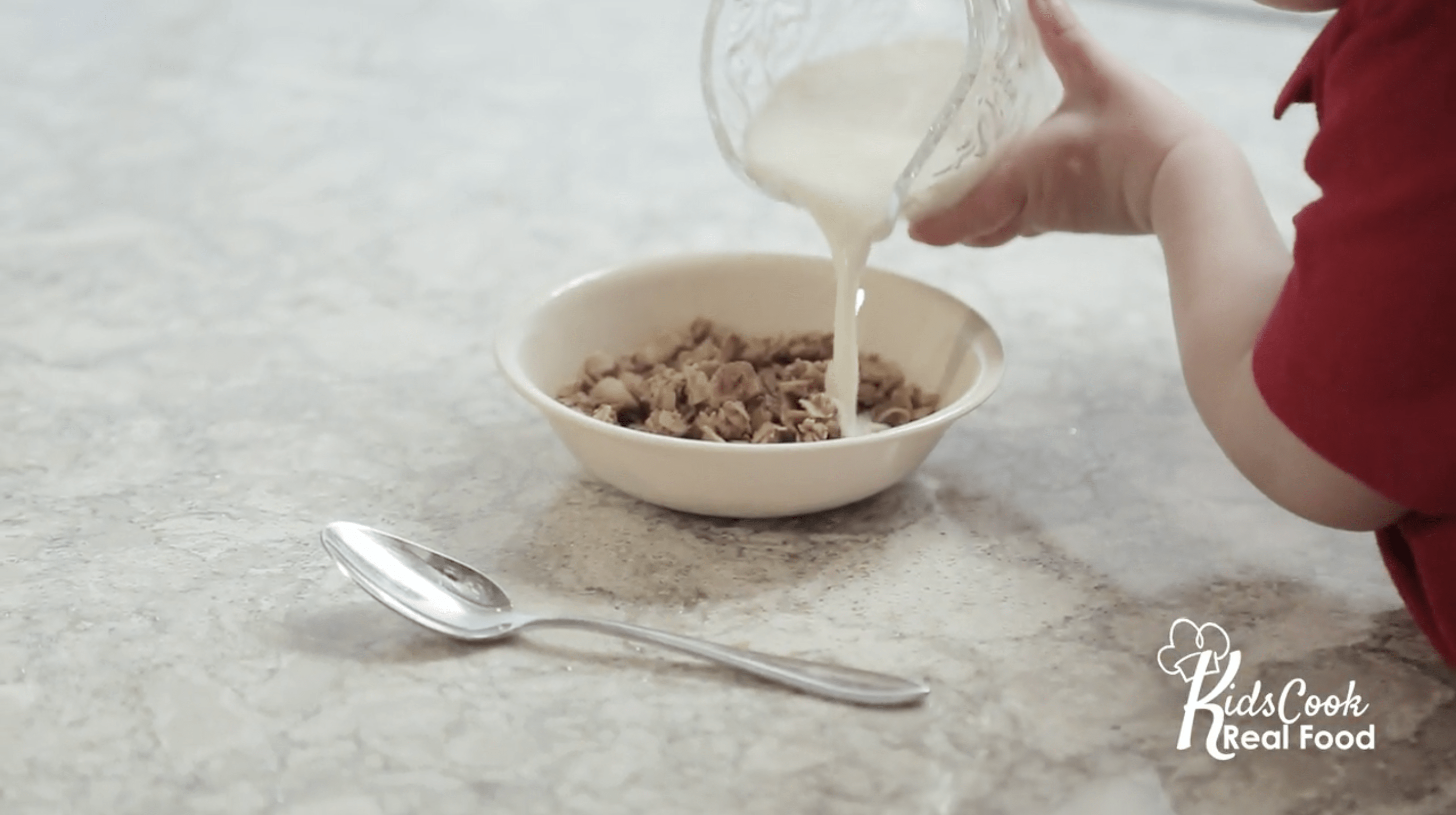 pouring milk into cereal bowl