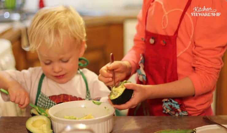 preschooler learning how to help cook