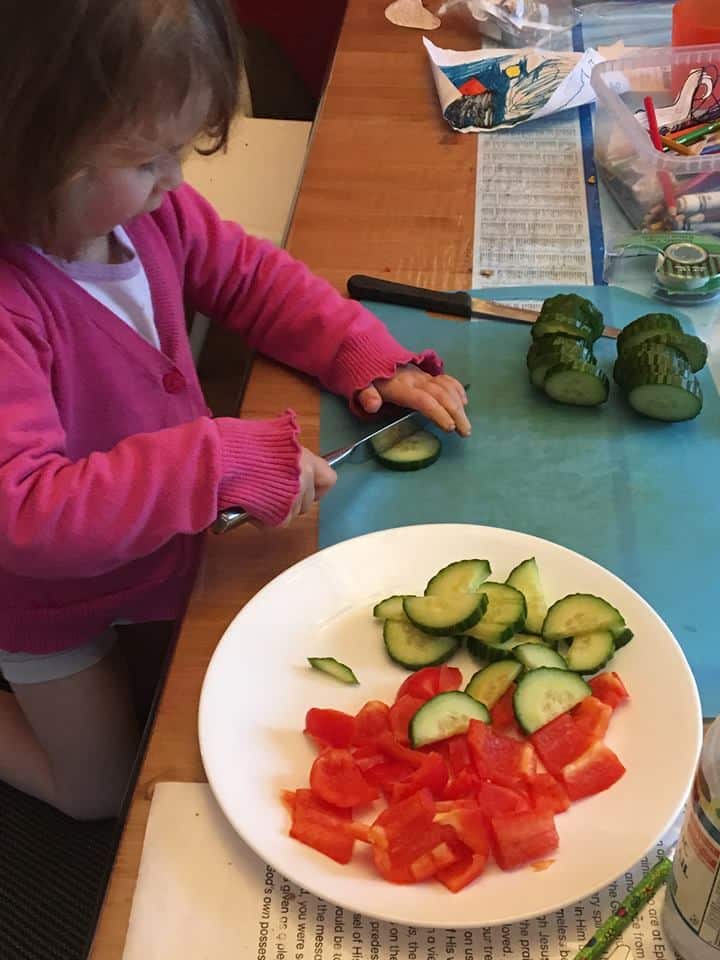 girl chopping veggies