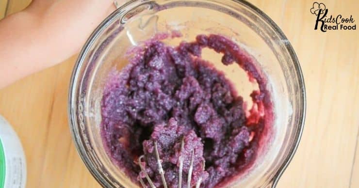 whisking gelatin into fruit juice 