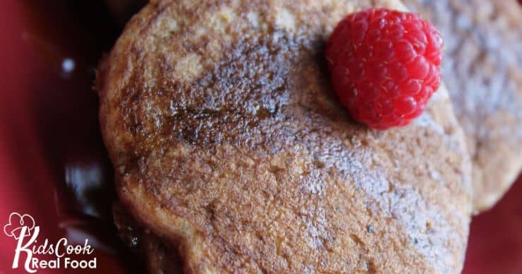 whole grain pancake with raspberry on top