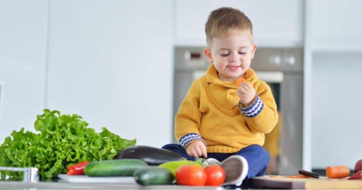 boy eating veggies
