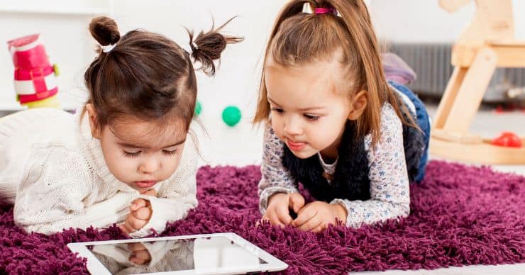 toddlers looking at tablet