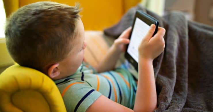 boy looking at tablet