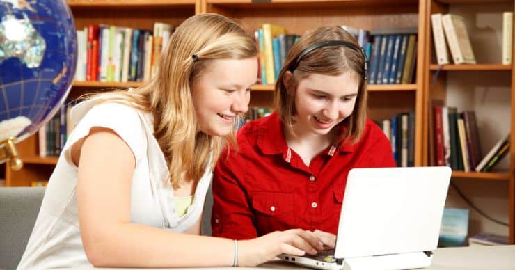 girls looking at computer