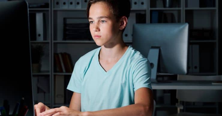 boy staring at computer