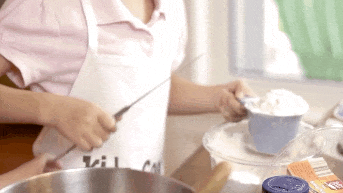 Child measuring flour