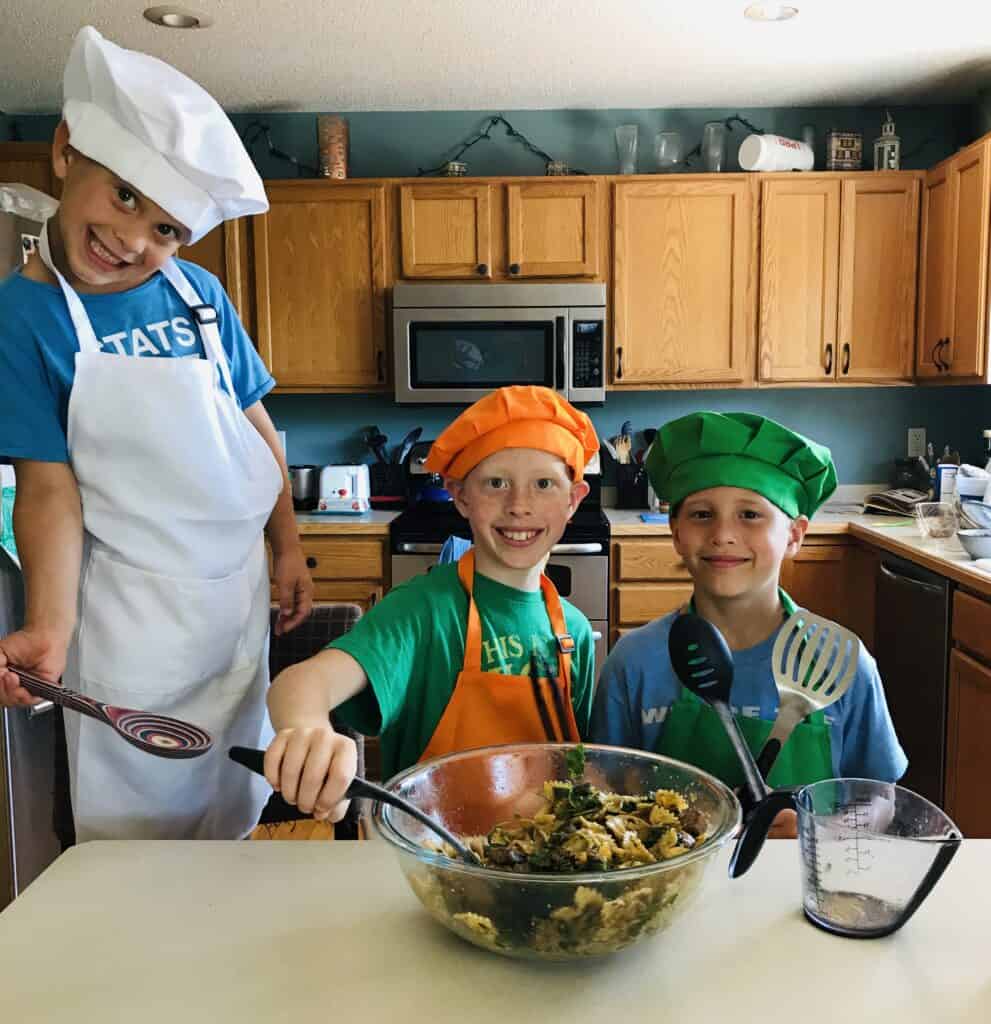 boys cooking pasta salad