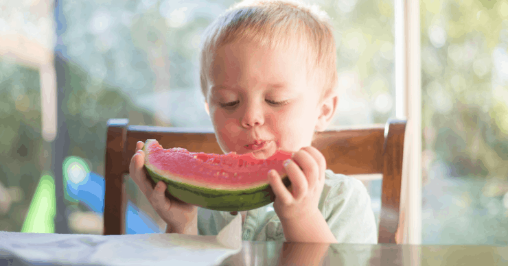 boy eating watermelon