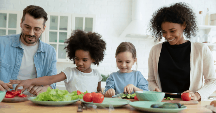 Family preparing vegetables first for dinner