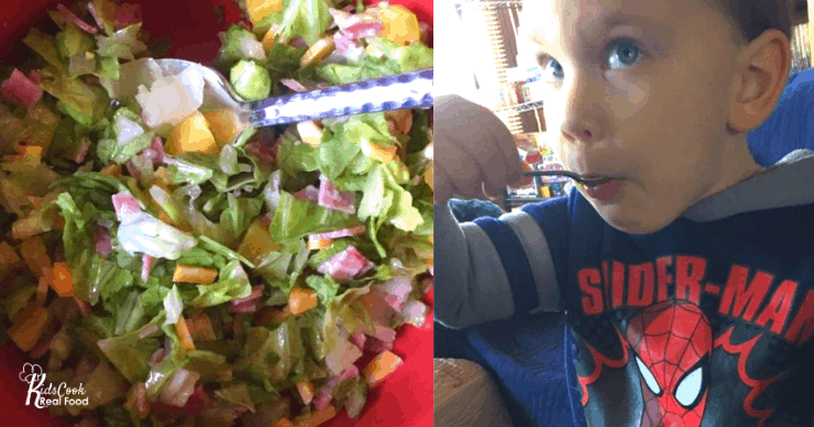 Toddler eating chopped salad with a spoon
