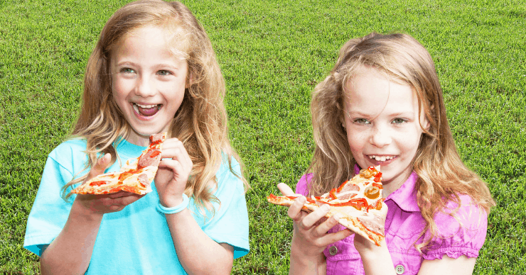 girls eating pizza