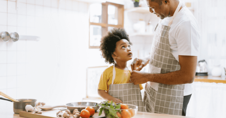 boy cooking with dad