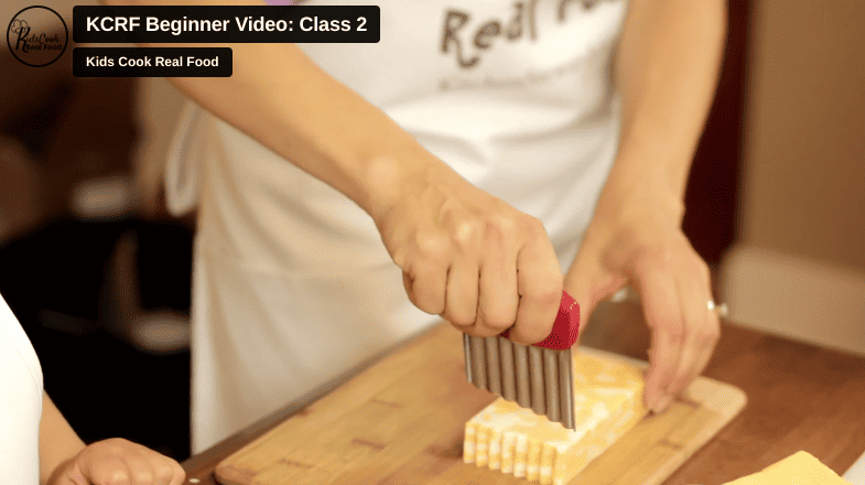 Katie Kimball using a crinkle cutter in the Kids Cook Real Food eCourse