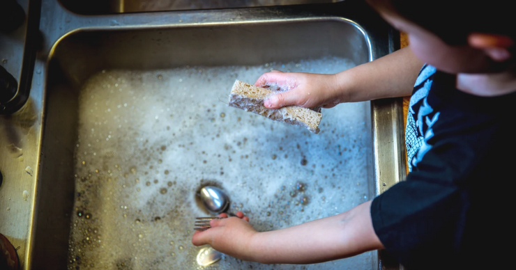 washing dishes in sink
