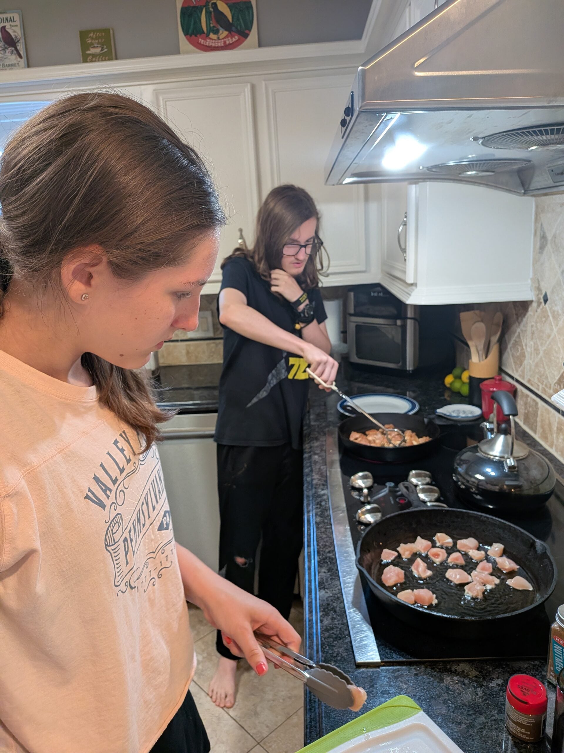 teens cooking together in the kitchen
