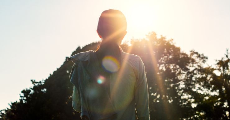 woman looking at sun