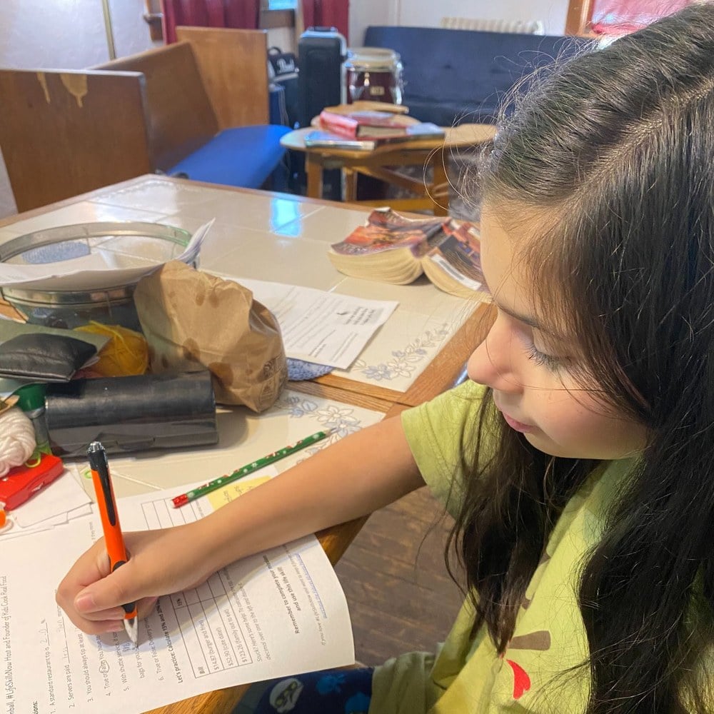 Girl working through the tipping worksheet